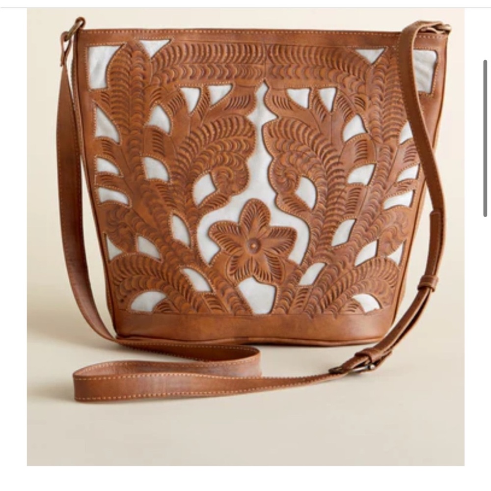Leaders in Leather Natural/Bone
Cutout Tooled Bucket Bag